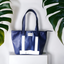 White Tote Bag surrounded by leaves