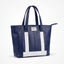 Wearsos Do Good Tote in navy blue and white upcycled aviation leather with dual handles and a zippered top closure.