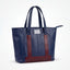 Wearsos Do Good Tote in navy blue and burgundy upcycled aviation leather with sturdy handles and a zippered top.